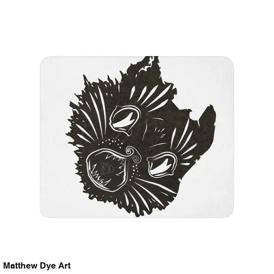 Black and white cat face design on an exquisite sherpa blanket for ultimate comfort