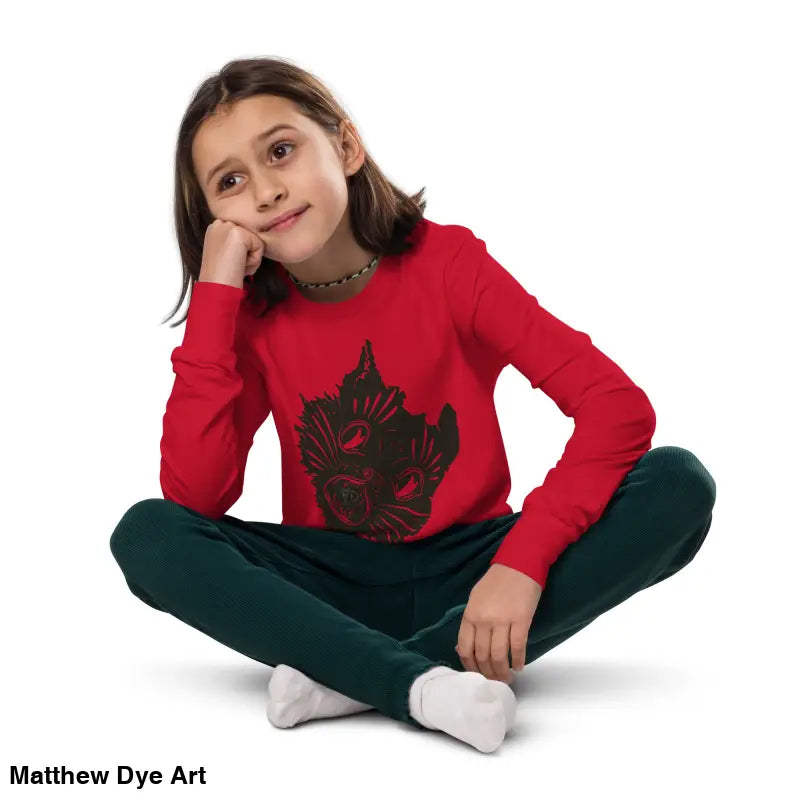 Girl in red shirt and green pants wearing Ah Kitty comfortable cotton unisex youth sweater