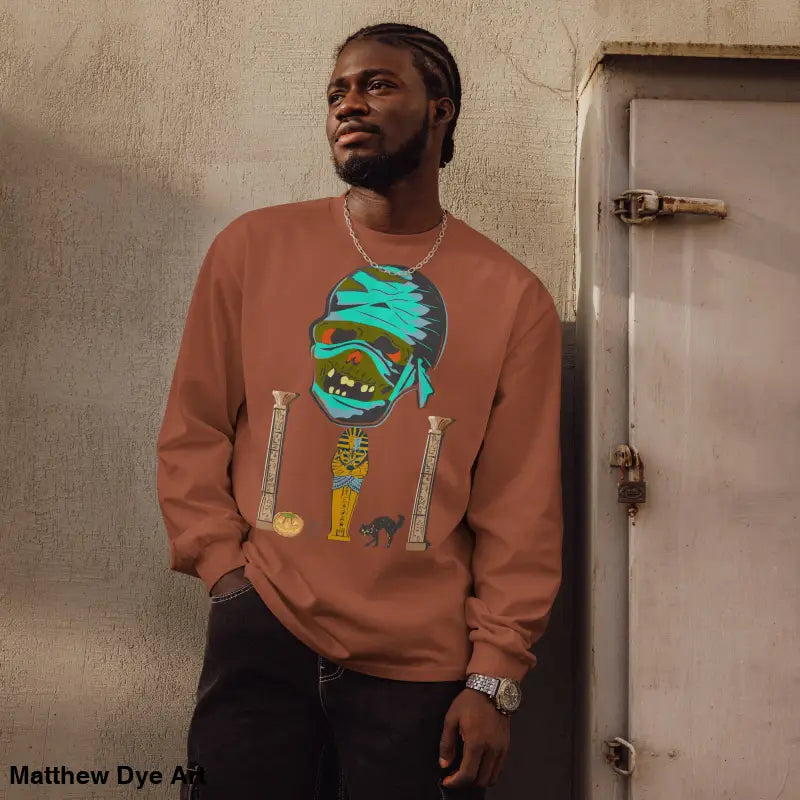 Man showcasing a premium long sleeve sweatshirt with mummy mystique design