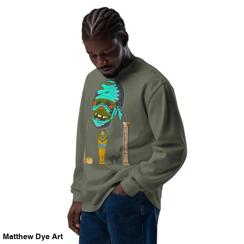 Man showcasing premium long sleeve sweatshirt featuring mummy mystique design