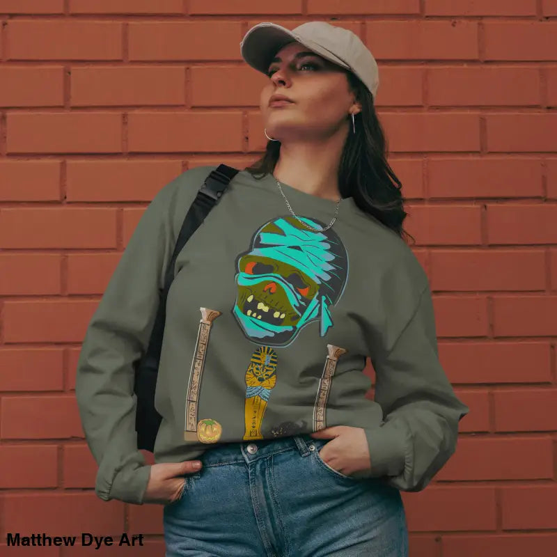 Woman in premium long sleeve sweatshirt featuring mummy mystique graphic design
