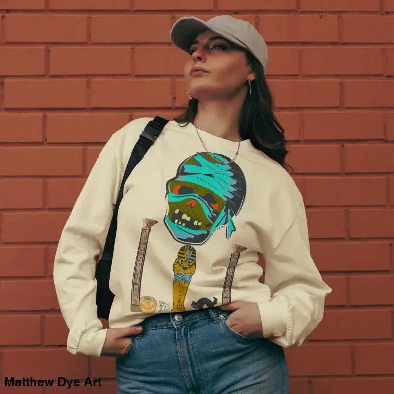 Woman in relaxed fit premium long sleeve featuring mummy mystique design
