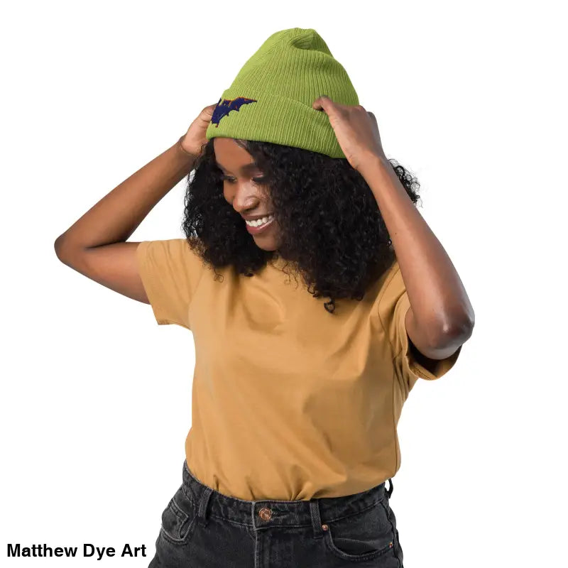 Green knit beanie with bat design, perfect for autumn and Halloween, warm and comfortable