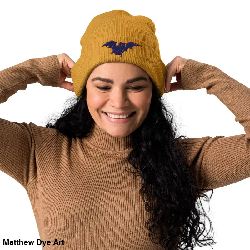 Mustard-colored Bat Baby Beanie, an organic ribbed beanie for autumn and Halloween