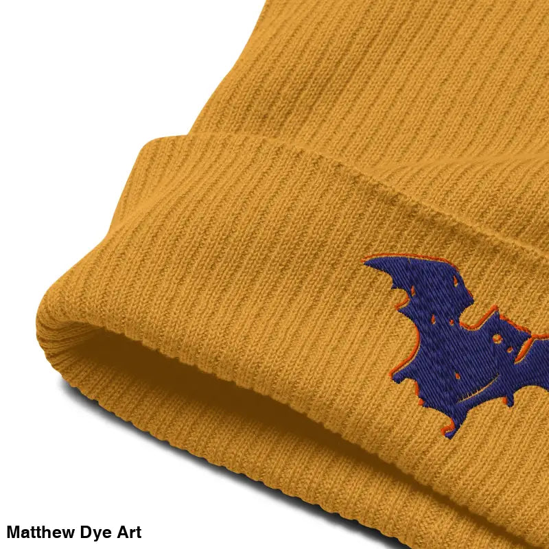 Mustard-colored knit beanie with bat embroidery, perfect for bat baby enthusiasts