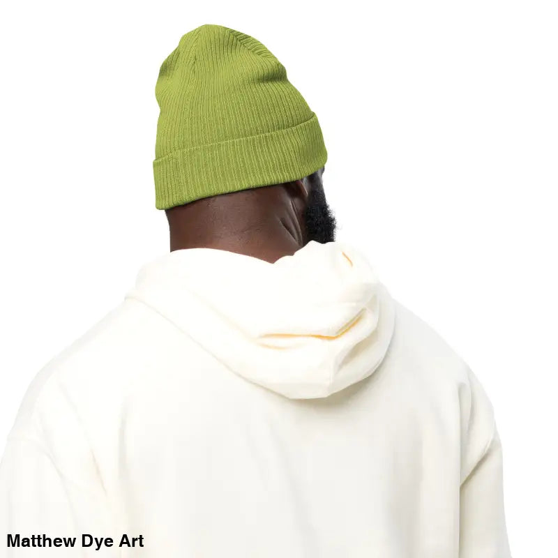 Person in a green beanie and white hoodie featuring the Bat Baby Beanie for autumn