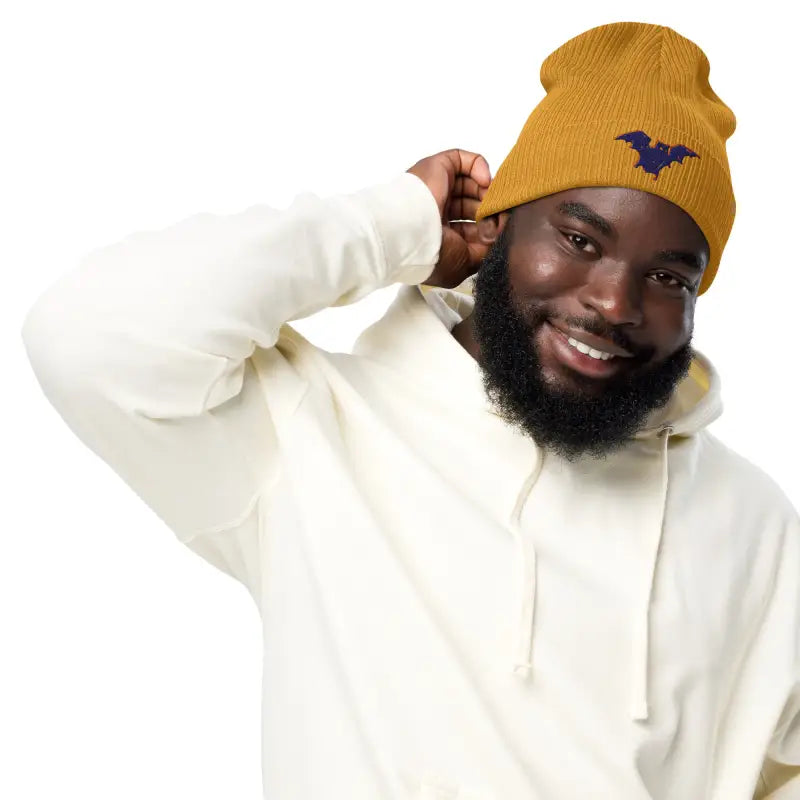 Mustard-colored bat baby beanie, an organic ribbed beanie for autumn and Halloween