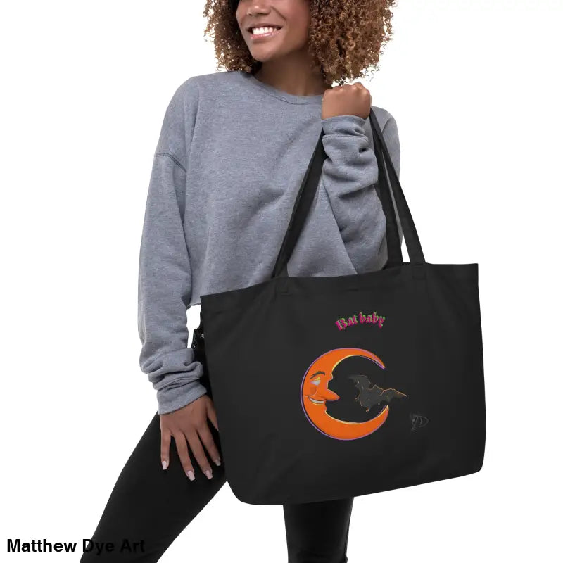 Black tote bag with moon and bat design, perfect for Halloween and retro aesthetics