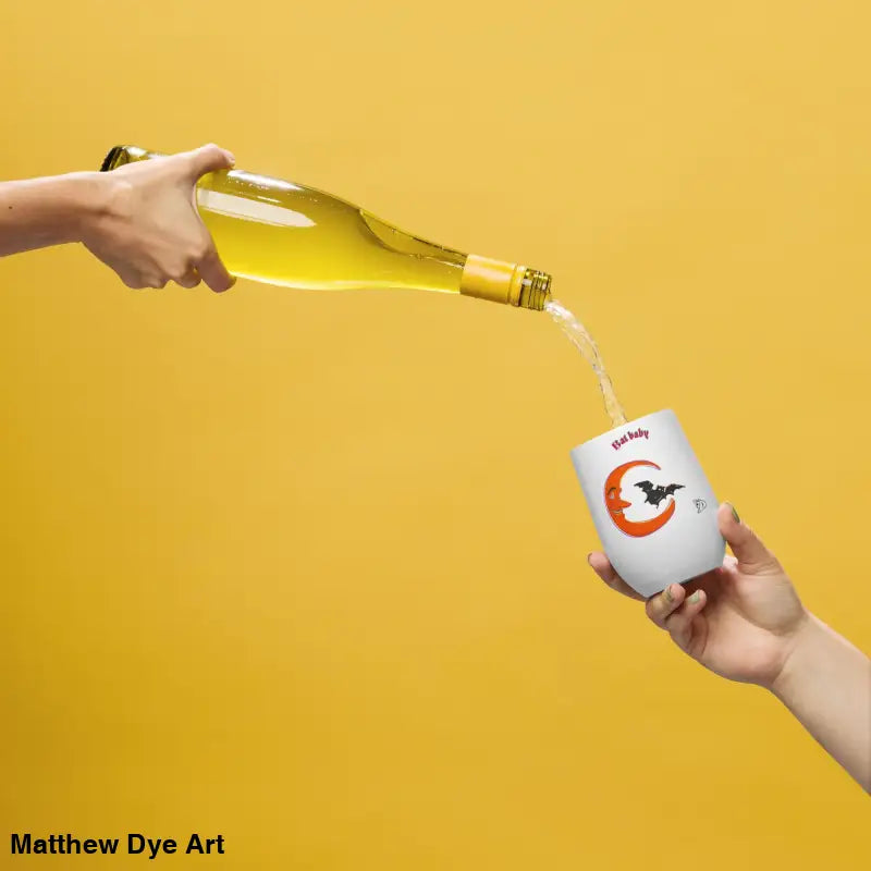 Wine being poured into a Bat Baby stainless steel tumbler for a retro Halloween experience