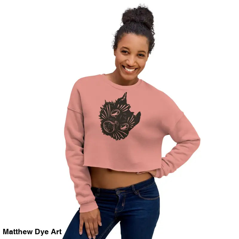 Woman in a cropped sweatshirt featuring a surreal cat design for spooky season style