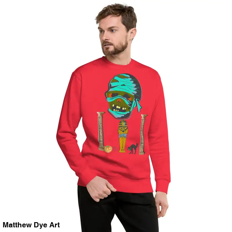 Red unisex mummy sweatshirt featuring an enchanting curse and ancient Egyptian graphic