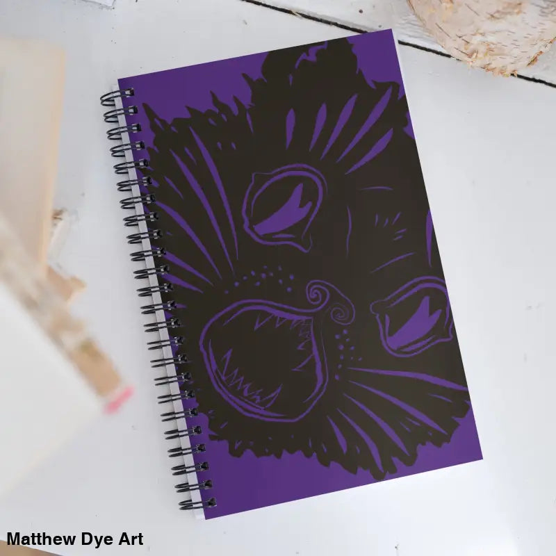 Purple spiral notebook with black cat design from Ah Kitty, perfect for Halloween