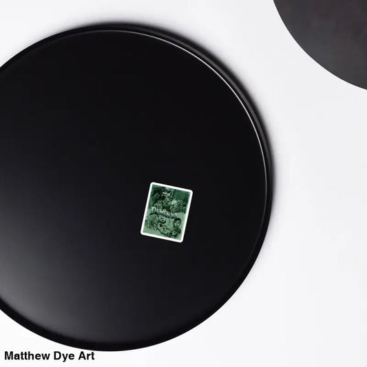 Black plate with green sticker featuring Dementia 13 Retro Horror Magnets design