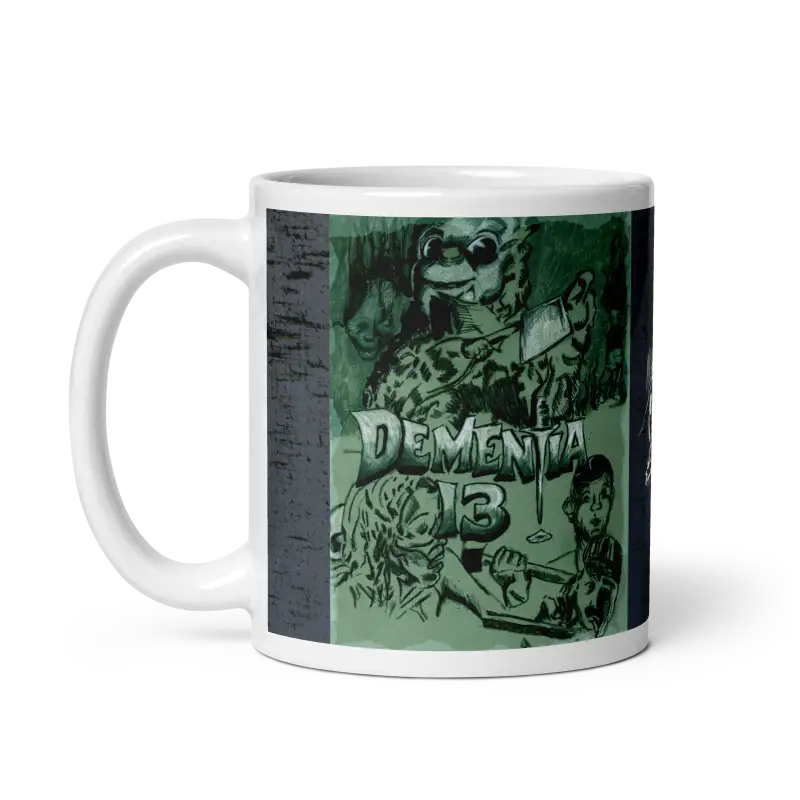 White ceramic mug with Dementia 13 artwork by Matthew Dye, epitomizing ghoulishly chic style