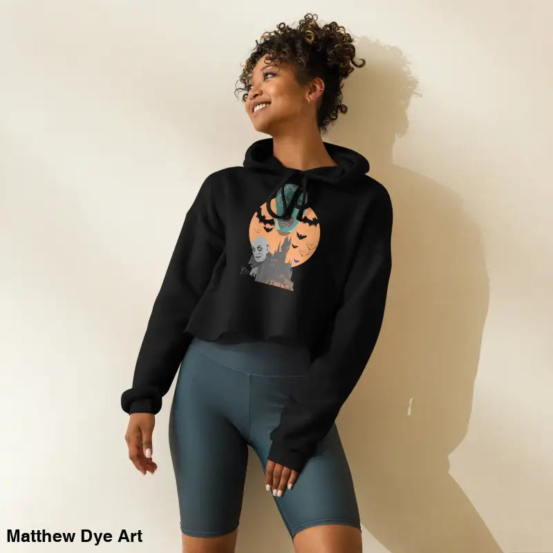 Black Halloween-themed cropped hoodie from Fangs & Fashion, meticulously crafted with Matthew Dye art