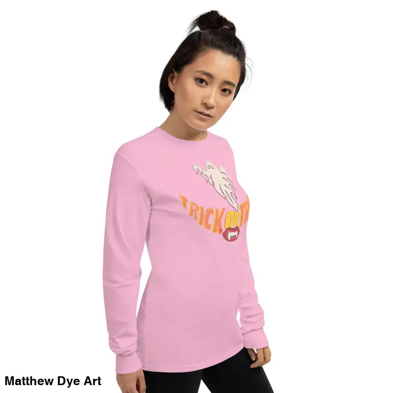 Pink long-sleeved Ghostly Grin Tee offers spooktacular comfort for Halloween festivities