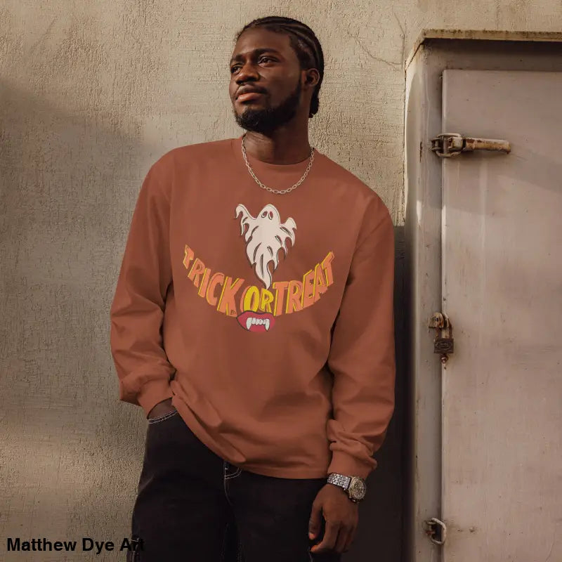 Premium long sleeve shirt featuring Jack-o’-Lantern Glow vintage Halloween art design