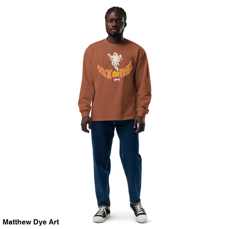 Man in a premium long sleeve shirt featuring Halloween-themed Jack-o’-Lantern art