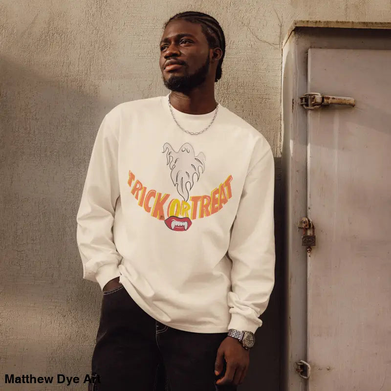 Man showcases premium long sleeve shirt with Jack-o’-Lantern Glow Halloween art