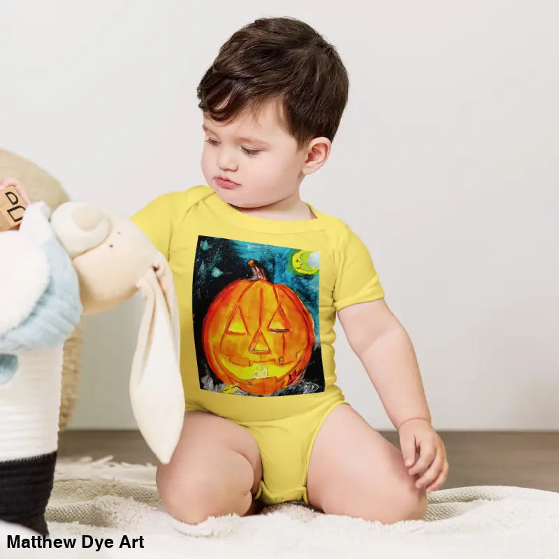 Yellow baby onesie in combed ring-spun cotton featuring an adorable jack-o’-lantern graphic