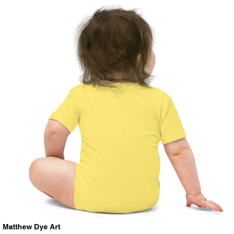 Adorable baby in yellow onesie made of combed ring-spun cotton for Halloween