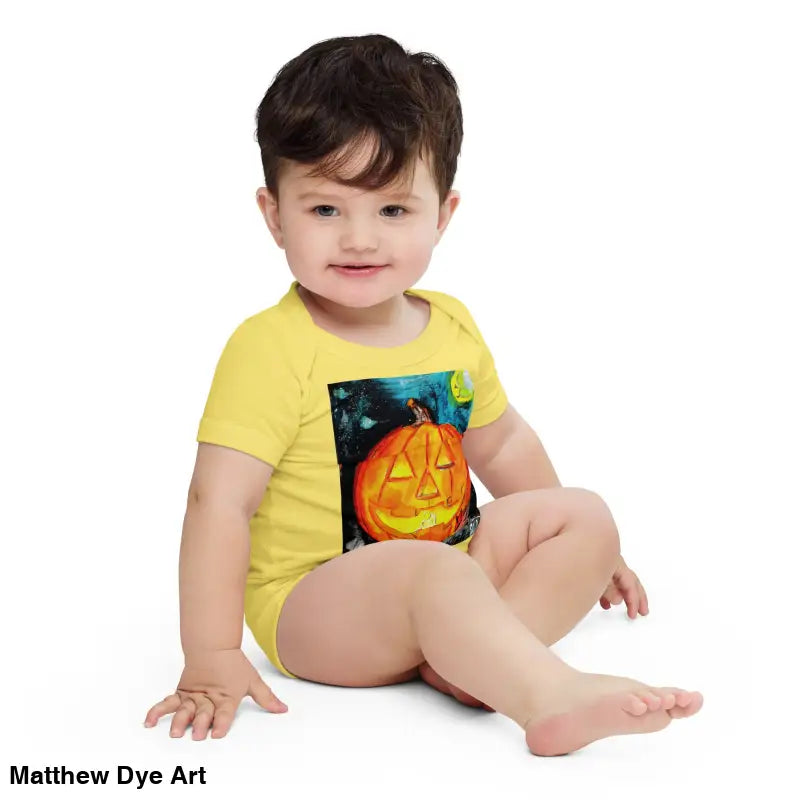 Adorable baby in yellow pumpkin onesie made of combed ring-spun cotton for Halloween