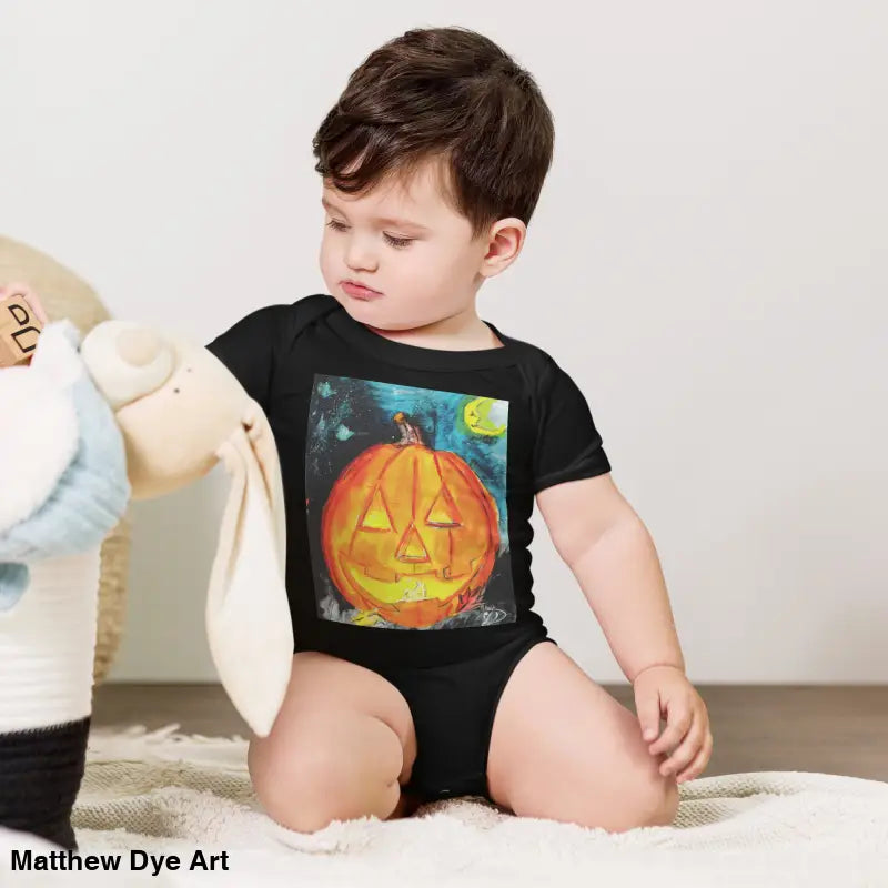 Black baby’s first Halloween onesie featuring adorable jack-o’-lantern graphic in soft cotton