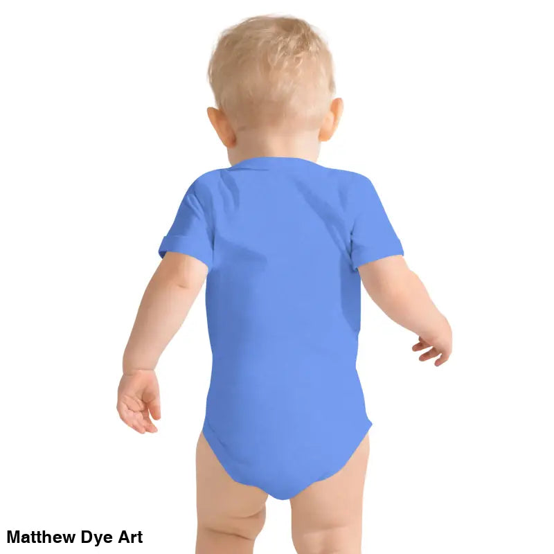 Baby in blue onesie featuring an adorable jack-o’-lantern for Halloween festivities