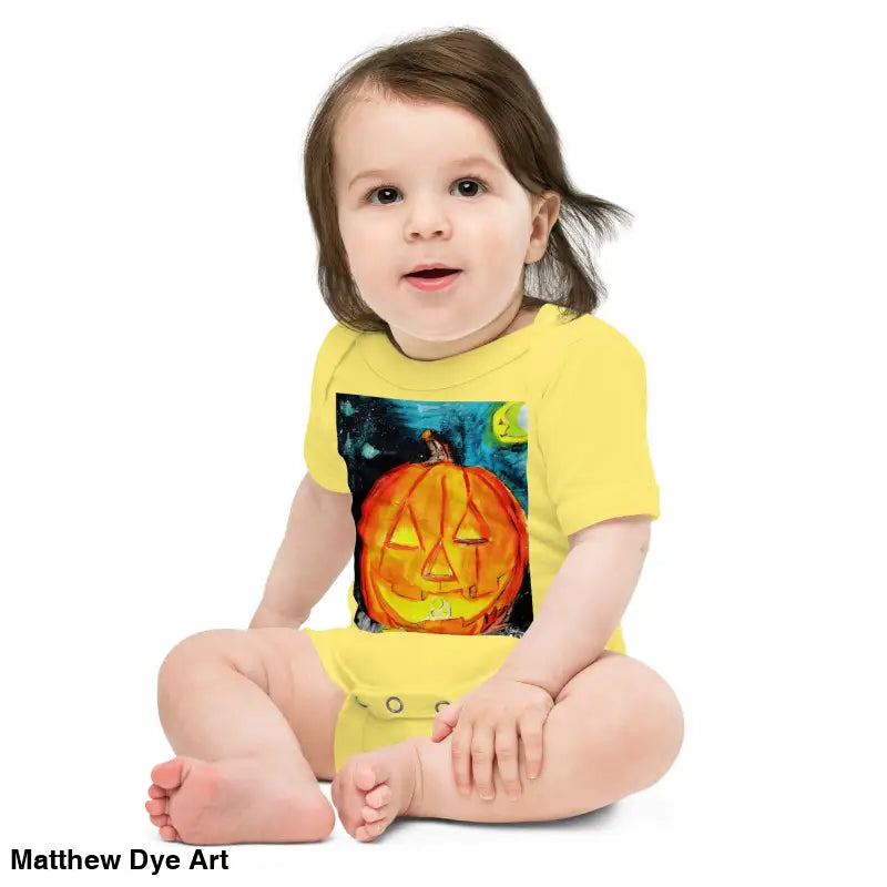 Baby in yellow pumpkin onesie made from combed ring-spun cotton, perfect for Halloween