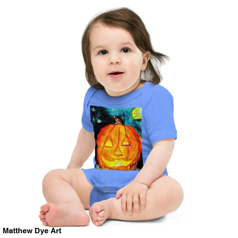 Baby in an adorable jack-o’-lantern onesie made of combed ring-spun cotton