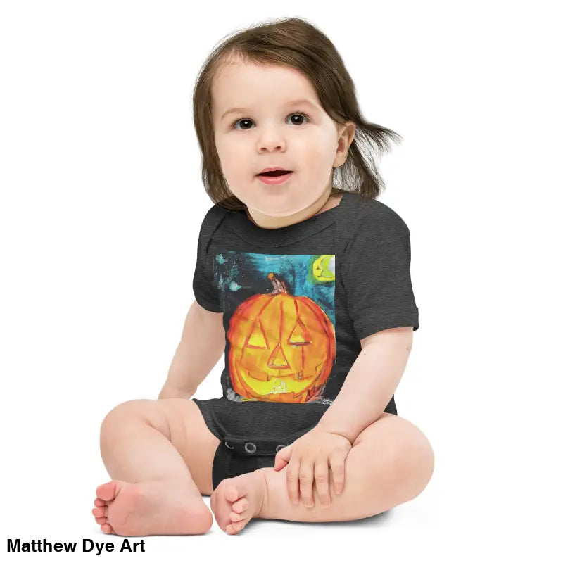 Baby in Lil Pumpkin Halloween onesie made of combed ring-spun cotton, featuring an adorable jack-o’-lantern