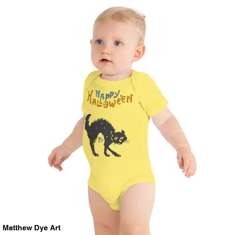 Baby in yellow Halloween onesie featuring scary cat Halloween design for festive fun