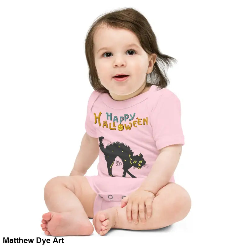 Baby in pink Halloween onesie showcasing Scary Cat Halloween enchantment