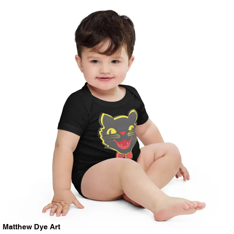 Baby in vintage black cat one-piece showcasing a playful cat graphic on a black onesie