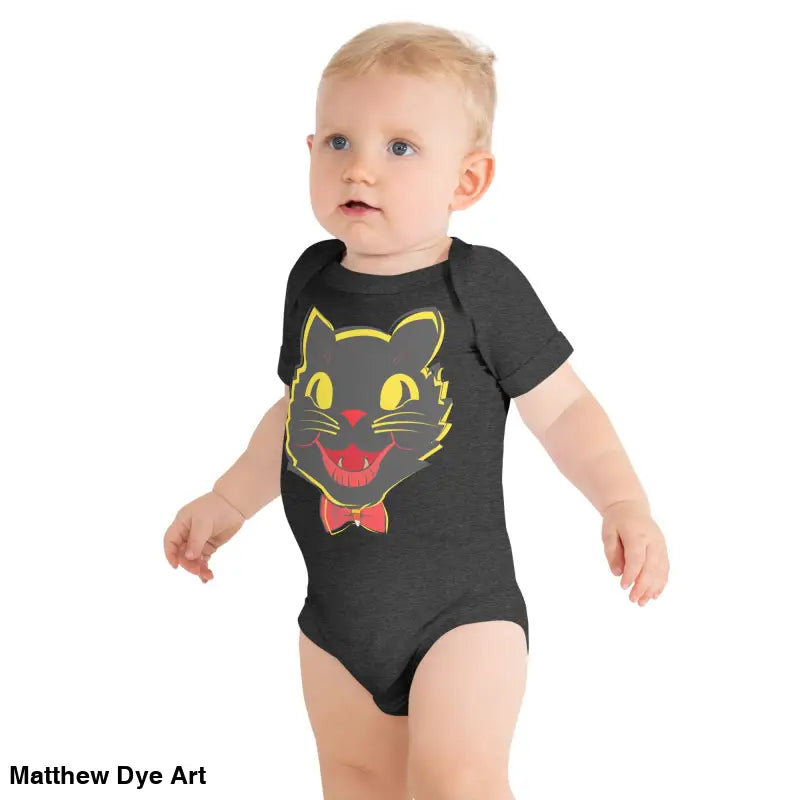 Baby in vintage black cat onesie featured in Little Pumpkin Halloween collection