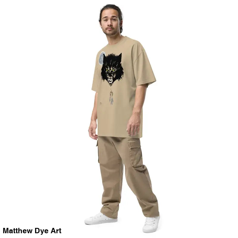 Man in Moonlit Howl oversized t-shirt with wolf graphic and cargo pants for gothic horror style