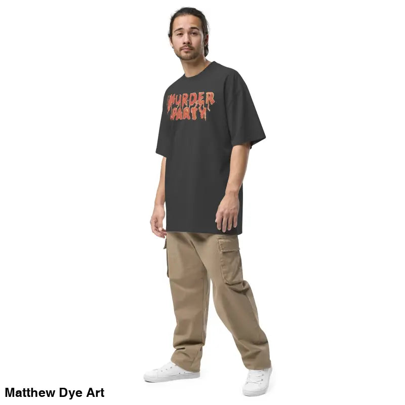 Man in black t-shirt and khaki pants featuring Murder Party Mayhem oversized style design