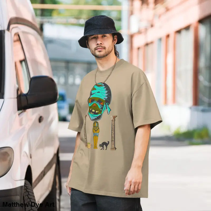 Beige mummy graphic on Pharaoh’s Curse unisex oversized faded t-shirt art