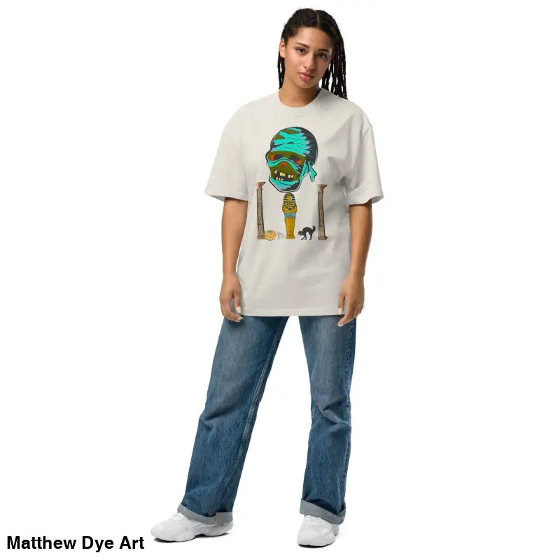 Woman modeling the Pharaoh’s Curse oversized tee featuring a nostalgic Halloween design