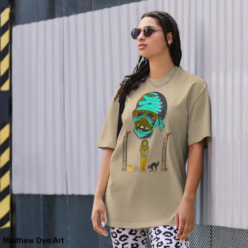 Woman in a mummy unisex oversized faded t-shirt featuring a nostalgic Halloween design