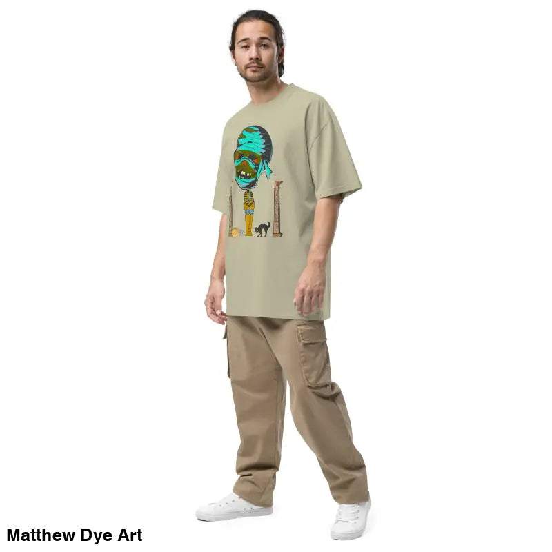 Man in cargo pants and a mummy unisex oversized faded t-shirt with surreal Halloween design