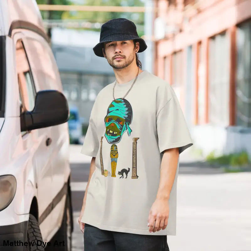 Man wearing mummy unisex oversized faded t-shirt with nostalgic Halloween design