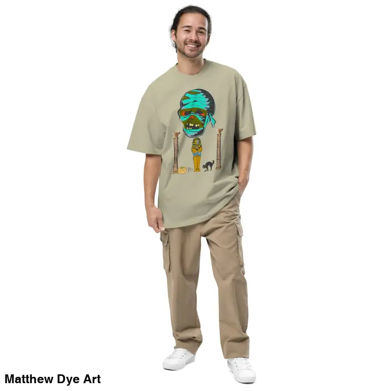 Man in Pharaoh’s Curse Oversized Tee with cargo pants showcasing a nostalgic Halloween design
