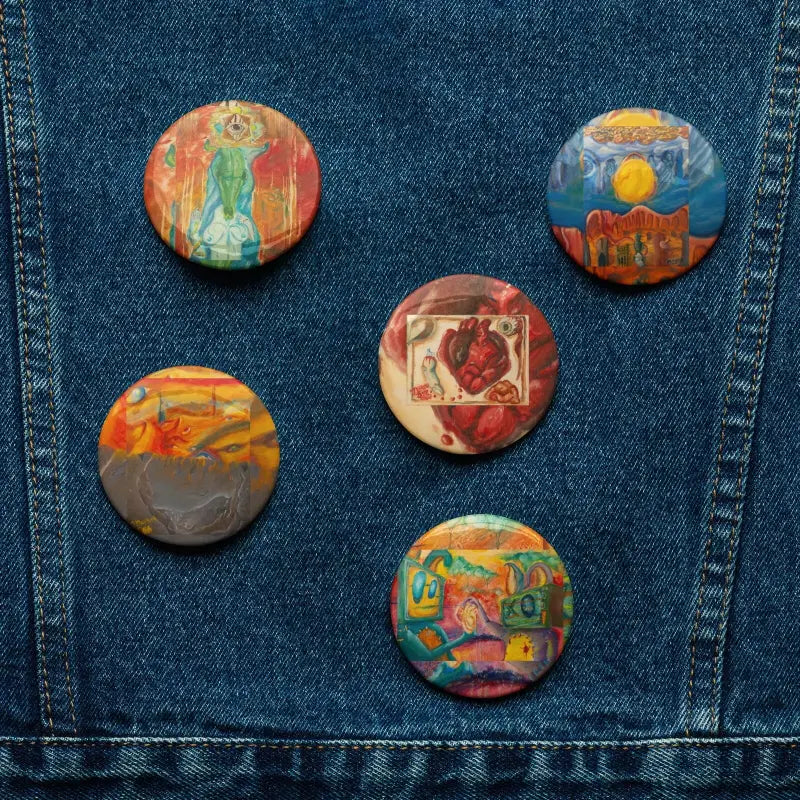 Matthew Dye Art Pin Set showcasing five colorful decorative pins on denim fabric