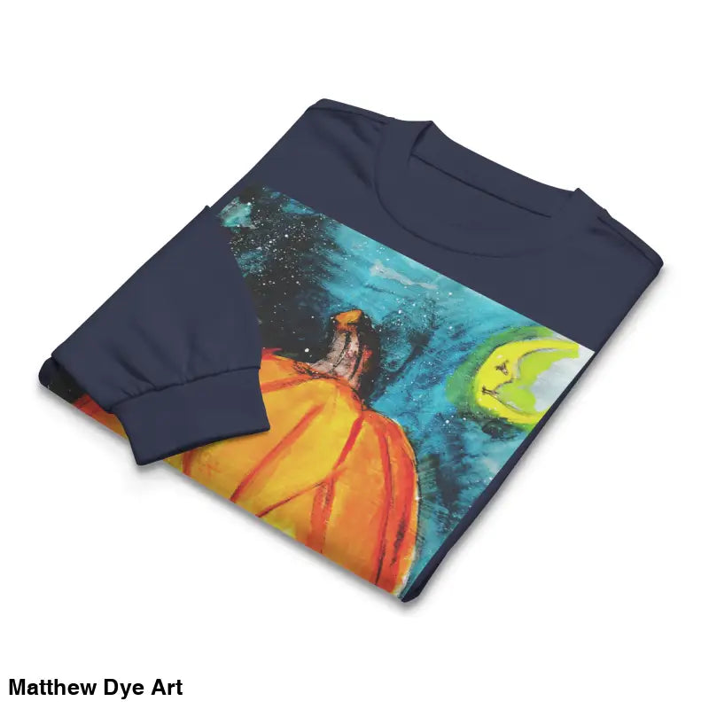 Folded long-sleeved shirt featuring Matthew Dye Art’s whimsical jack-o’-lantern design