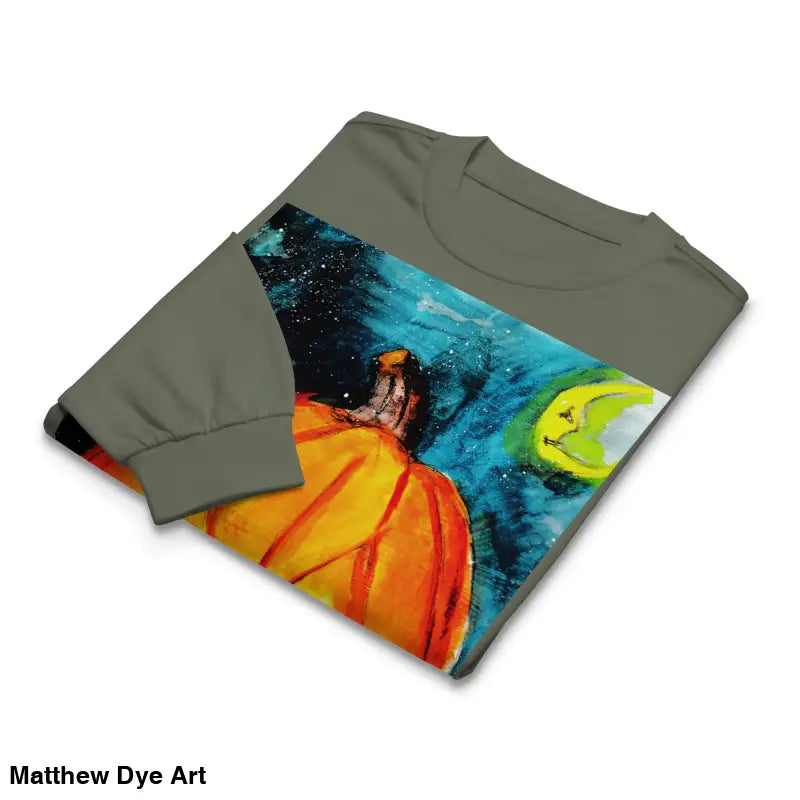 Folded long-sleeved shirt featuring Matthew Dye Art’s whimsical jack-o’-lantern design