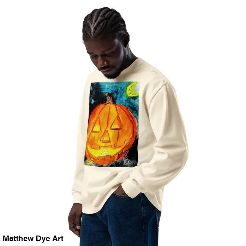 Beige sweatshirt featuring Matthew Dye Art’s whimsical jack-o’-lantern design