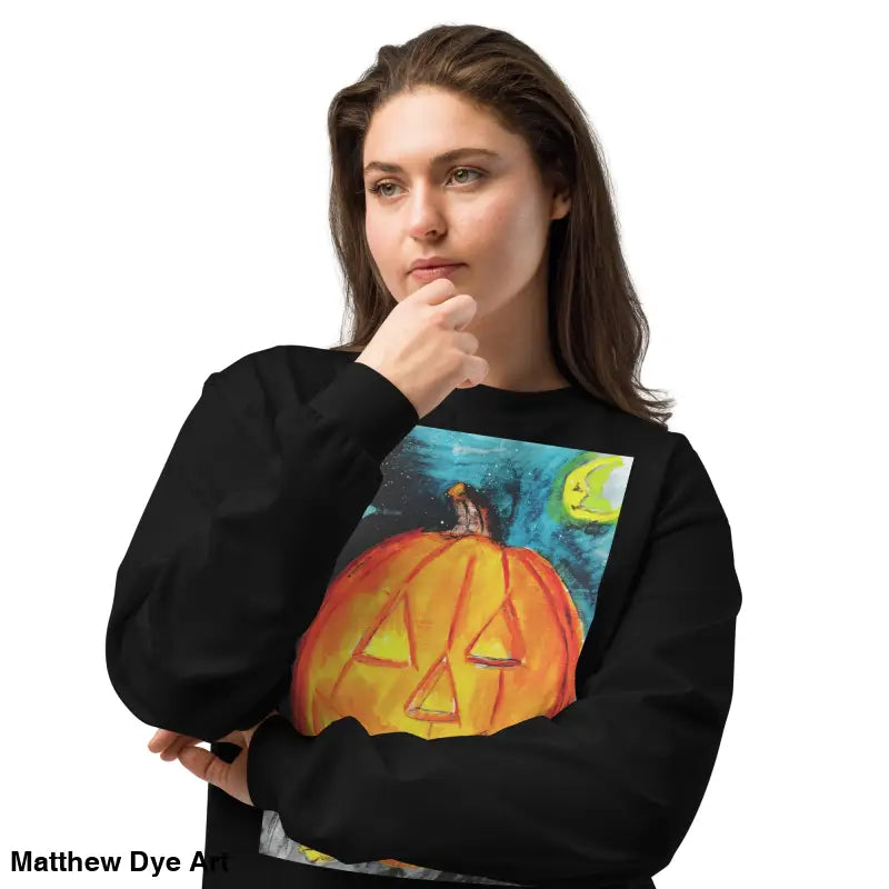 Black sweatshirt featuring Matthew Dye Art’s whimsical jack-o’-lantern design