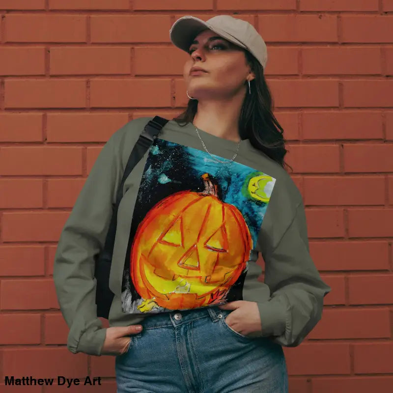 Pumpkin Mischief sweatshirt featuring Matthew Dye Art’s whimsical Jack-o’-lantern design