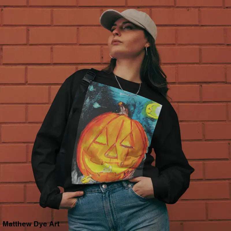 Pumpkin Mischief sweatshirt featuring Matthew Dye Art’s whimsical jack-o’-lantern design